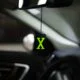 Acrylic Fluorescent Green X Car Premium Mirror Hanging